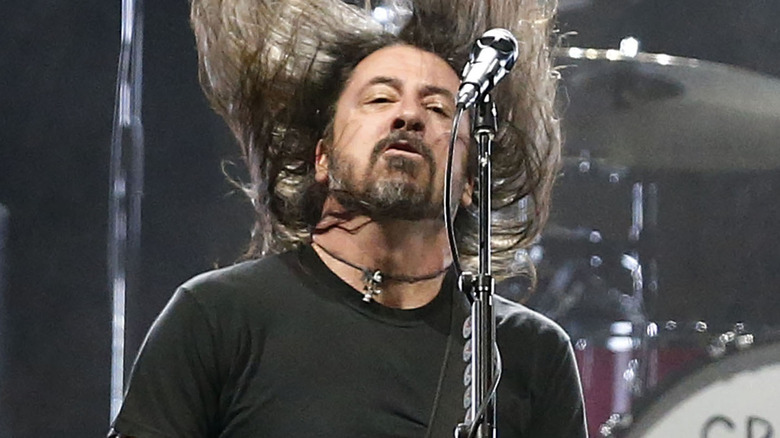 Dave Grohl on stage drums and guitar