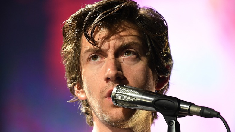 Alex Turner singing into Microphone