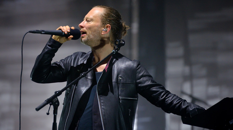 Thom Yorke in leather with mic