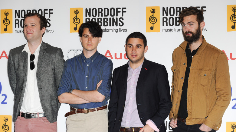 Vampire Weekend posing at award ceremony