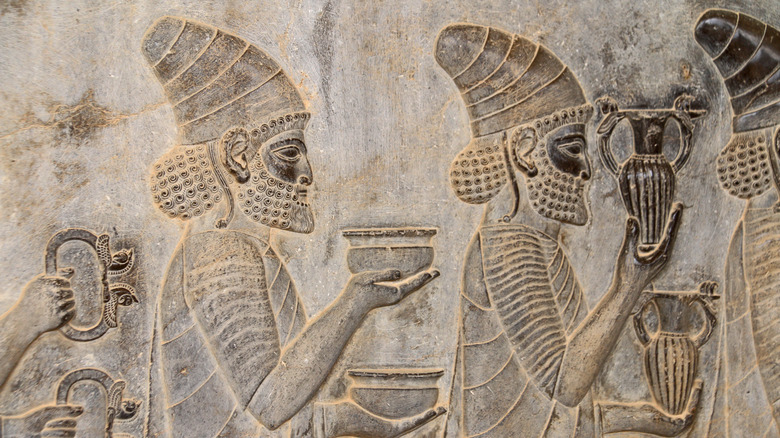 Ruins and bas reliefs carvings of ancient city Persepolis, Iran