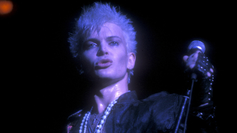 Billy Idol holding mic stand