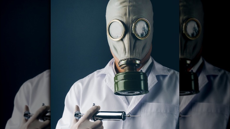 Horror doctor holding syringe 