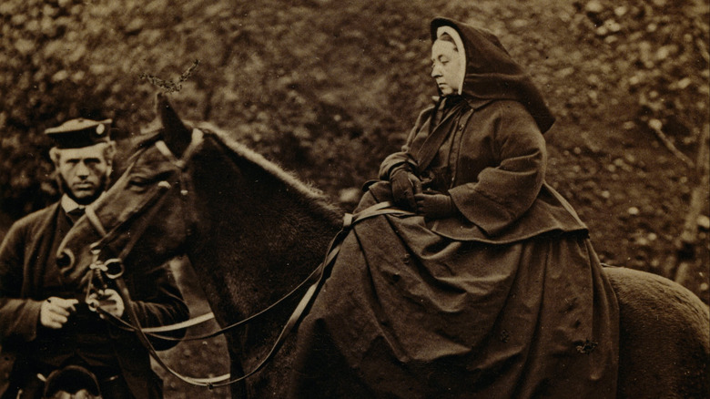John Brown holding Queen Victoria's horse