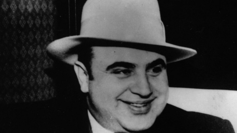 Al Capone wearing hat smiling