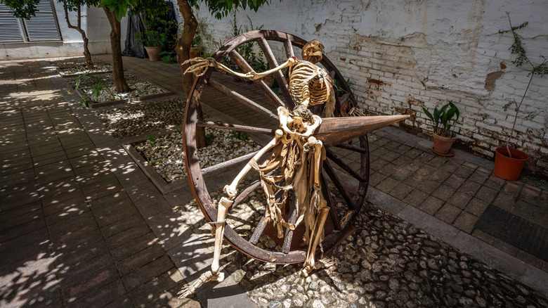 skeleton on breaking wheel in spanish museum