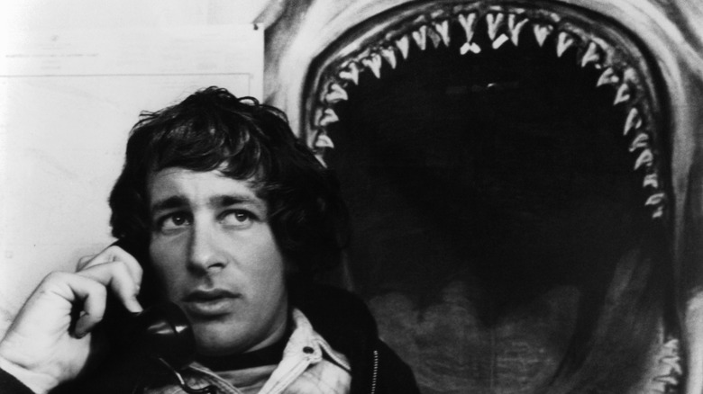 Steven Spielberg posing with Jaws shark