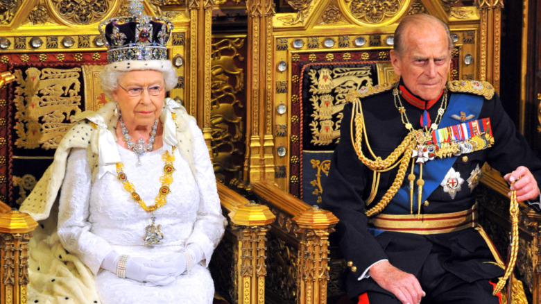 Prince Philip and Queen Elizabeth sitting on throne