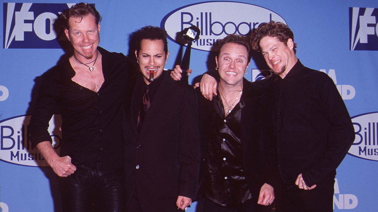 Metallica at event black shirts smiling
