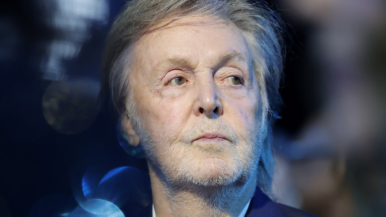 McCartney in suit looking to left