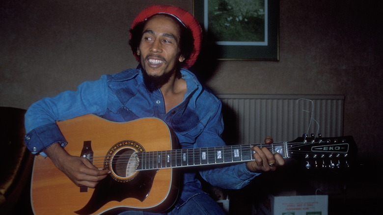 Bob Marley playing guitar