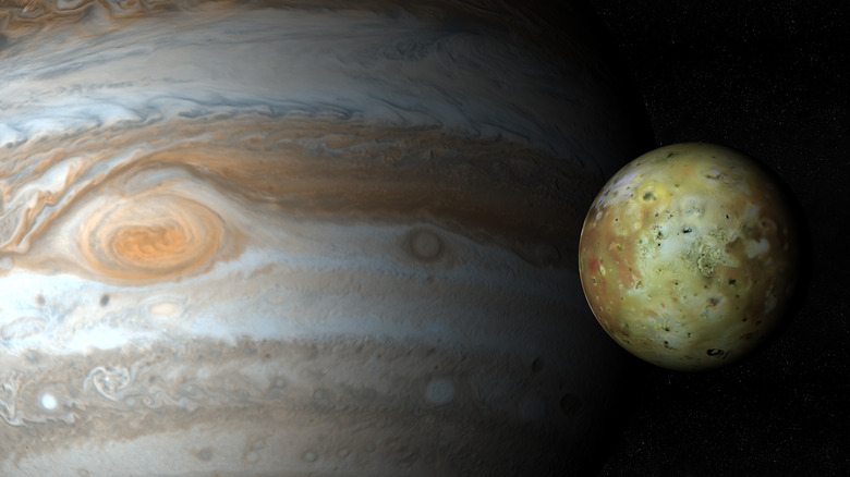 Io next to Jupiter