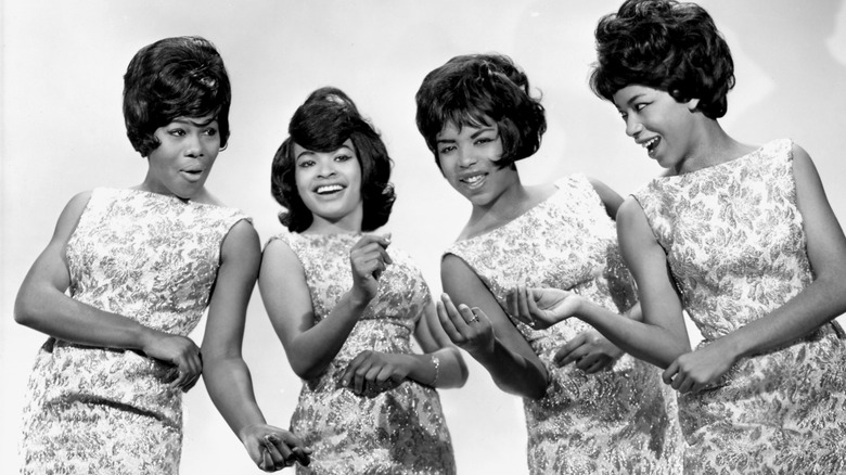 The Marvelettes smiling together clicking their fingers