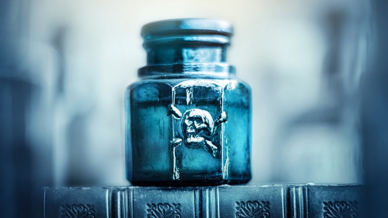 glass poison bottle skull crossbones