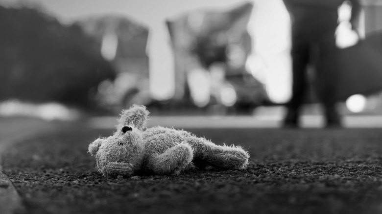 abandoned teddy bear in street