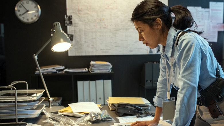Investigator looking at documents