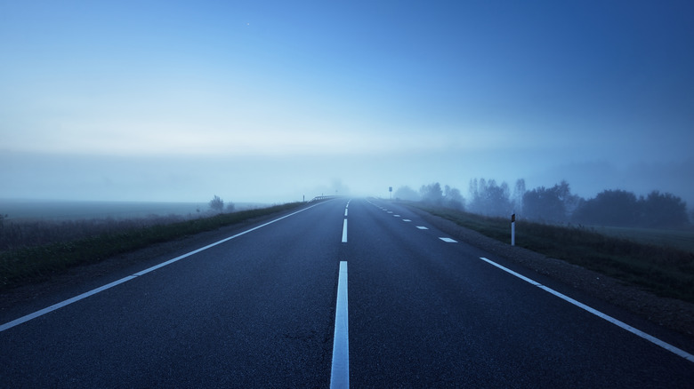 deserted highway fog in distance