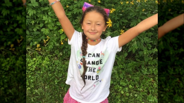 Madalina Cojocari smiling with arms in air