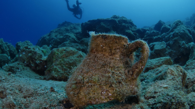 An amphora jar and diver