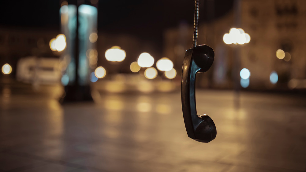 Abandoned busy pay phone 
