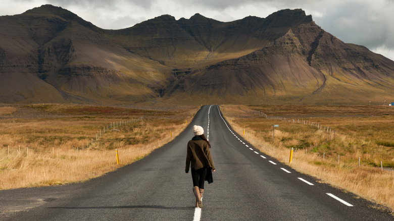 Woman alone on desert road