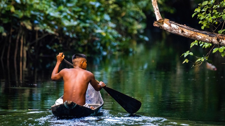 Indigenous person in Amazon rainforest