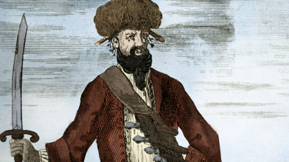 Blackbeard brandishes sword