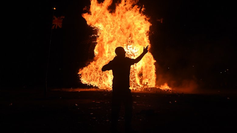 man dancing fire