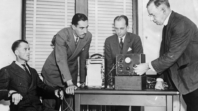 Men in 1937 run lie detector