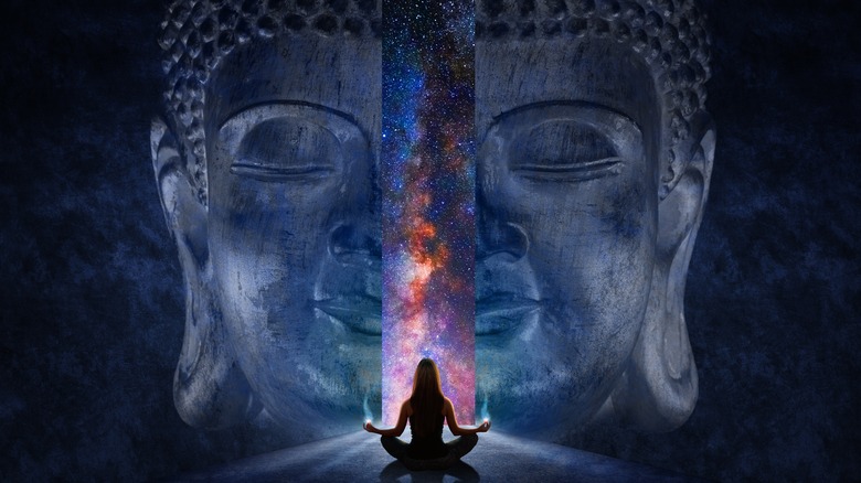 Women meditating cosmic Buddha