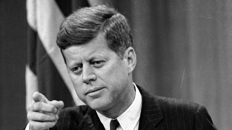 JFK at podium pointing finger at audience