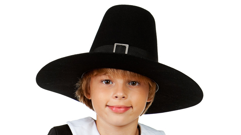 Child in a 'Pilgrim' hat