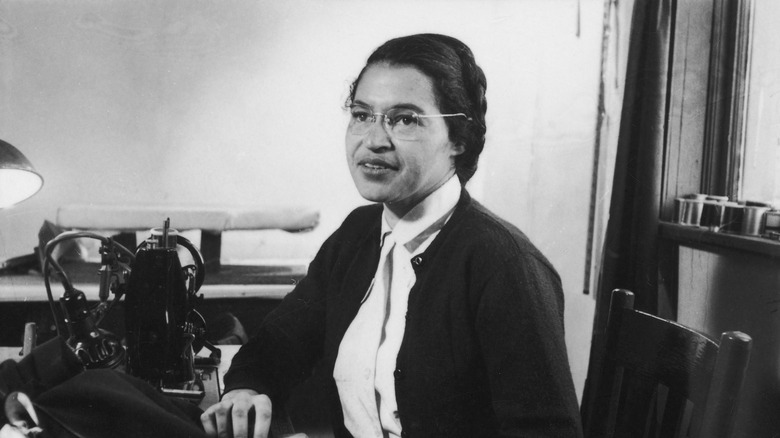 Rosa Parks seated and looking at someone