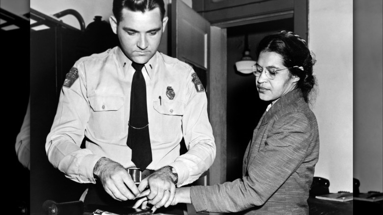 Rosa Parks being fingerprinted by police.