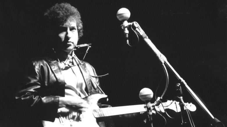 Bob Dylan with electric guitar at Newport Folk Fest, 1965