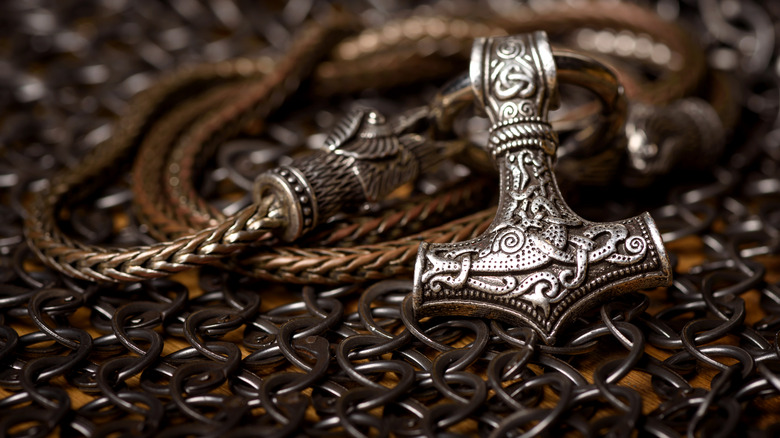 Silver Mjölnir pendant on chain.