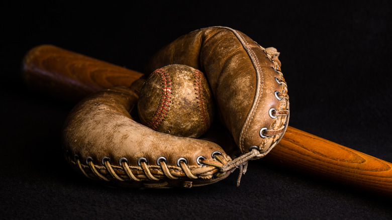 Old baseball glove and ball