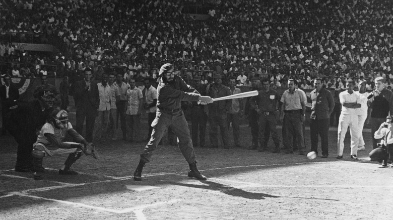 Fidel Castro at bat in military fatigues