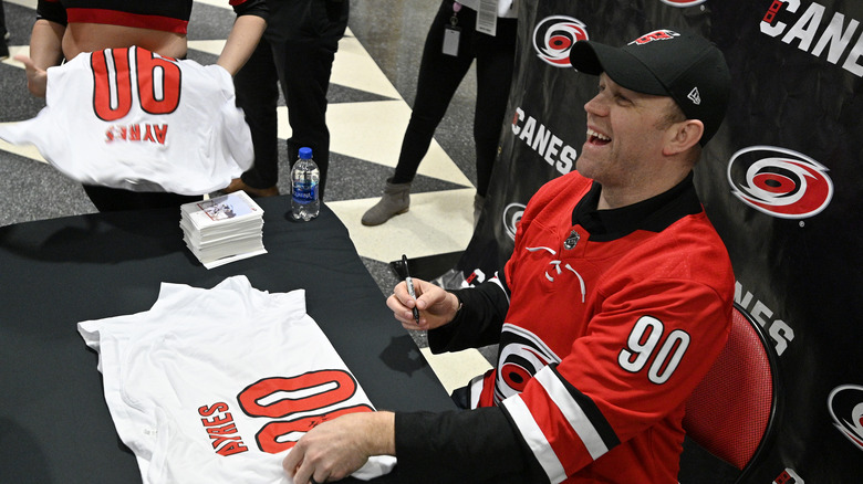 David Ayres signing autographs