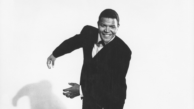 Chubby Checker doing the Twist in dark suit