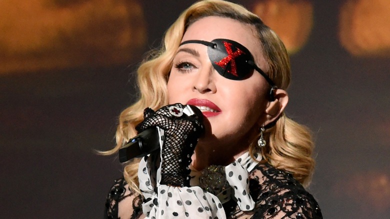 Madonna singing on stage with eyepatch