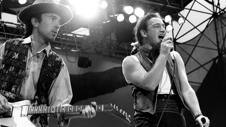 The Edge and Bono of U2 perform on stage