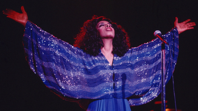 Donna Summer lifting arms to sky