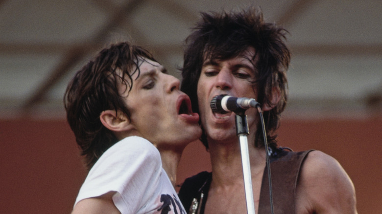 Mick Jagger and Keith Richards sharing mic on stage