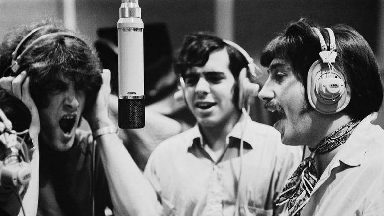 Tommy James and the Shondells in a recording booth in the 1960s