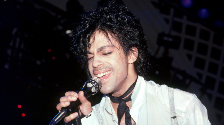 Prince singing onstage