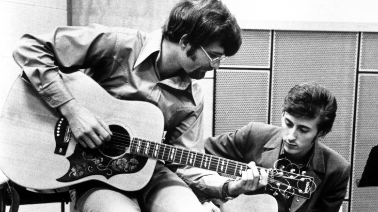 Zager and Evans playing guitars in recording studio