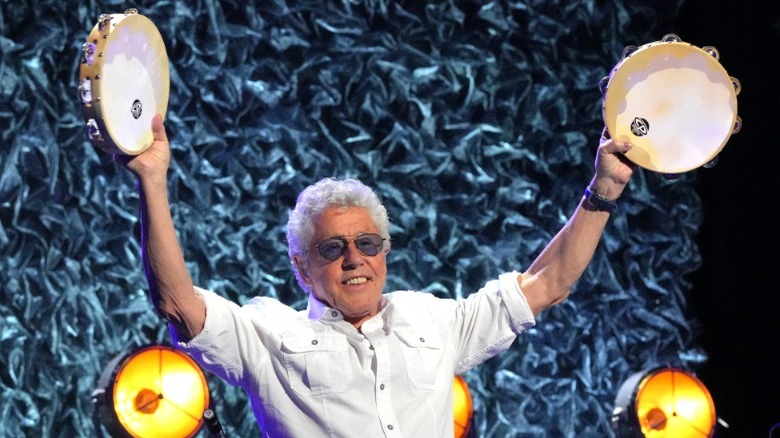Roger Daltrey waving tambourines