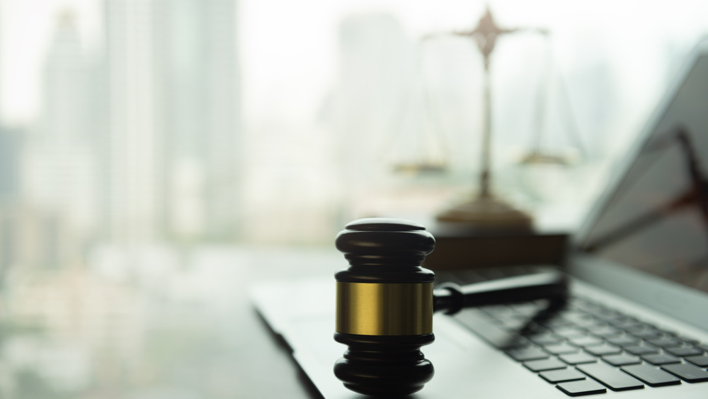 gavel and laptop on a desk