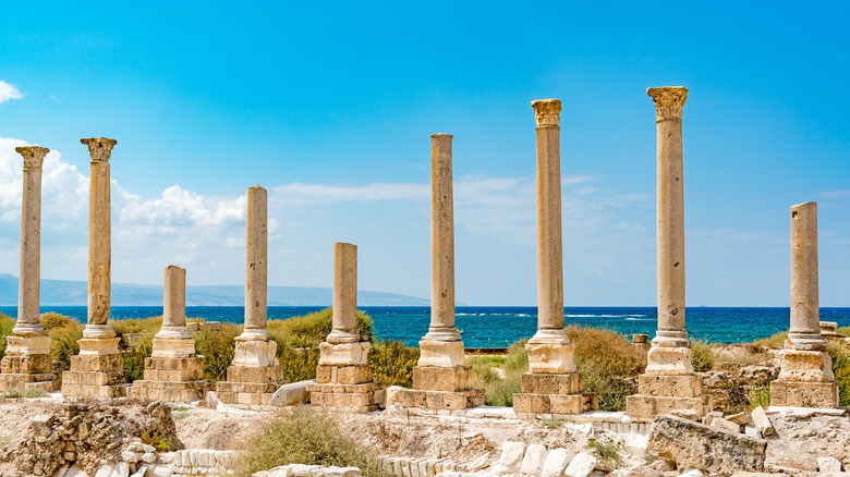 Ocean peaks through ancient columns